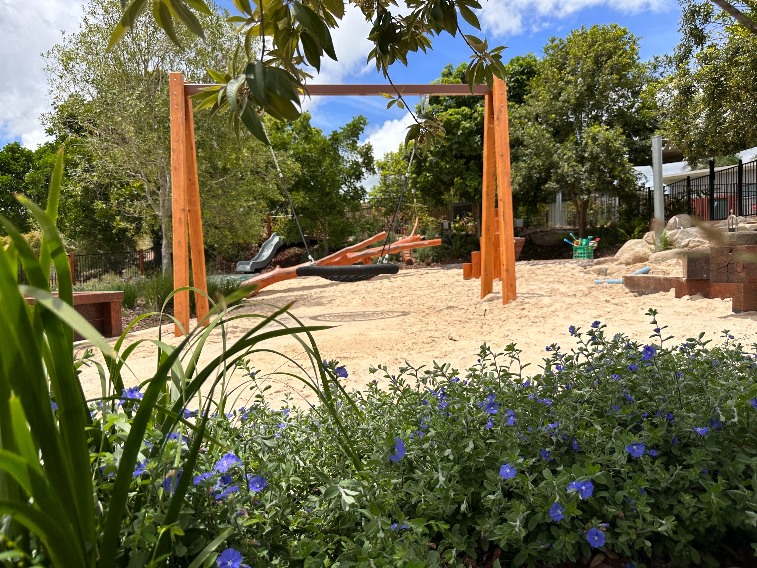 Outdoor timber play structure/swing.