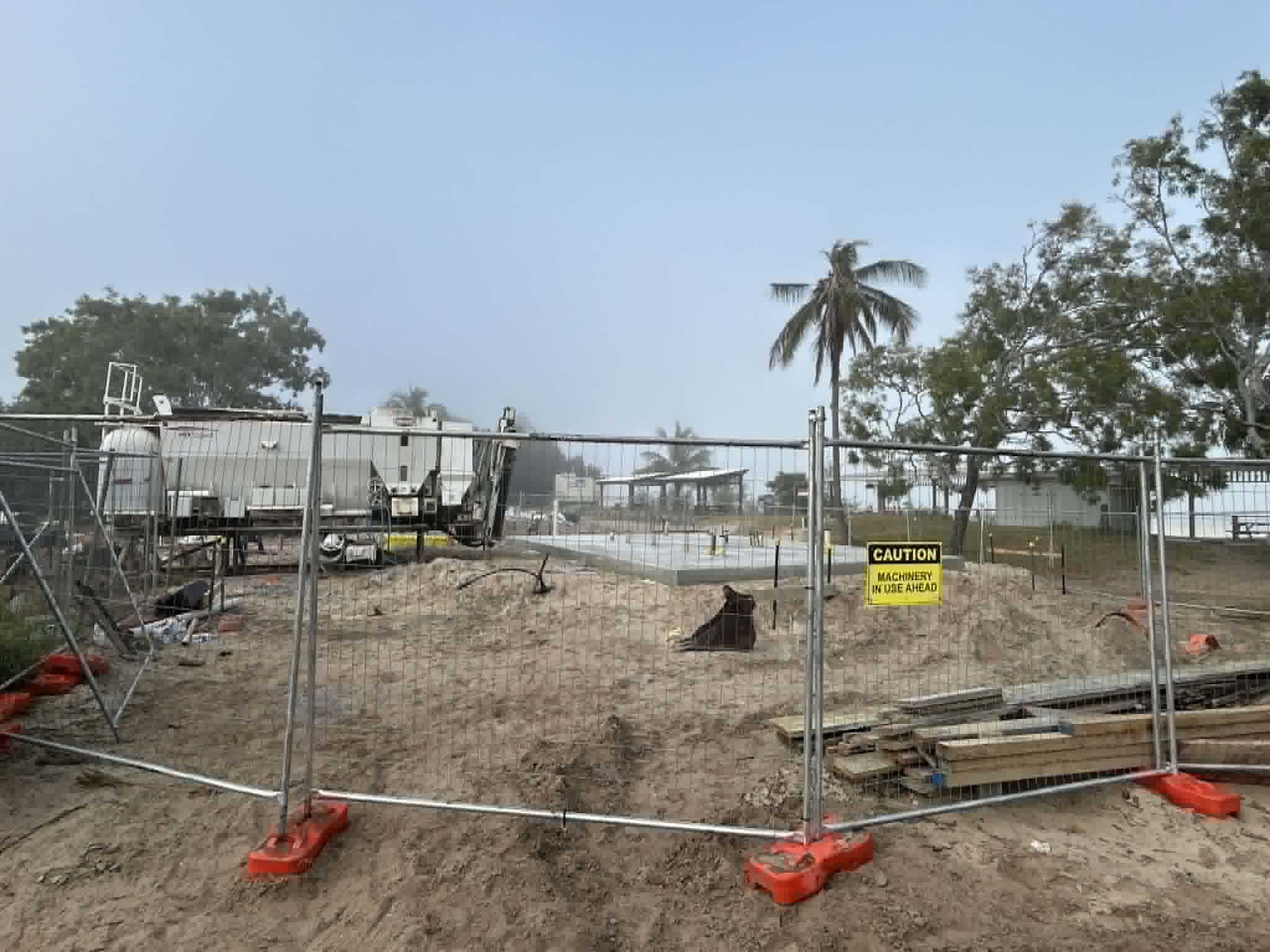 Concrete slab behind construction metal wire fencing on Great Keppel Island 