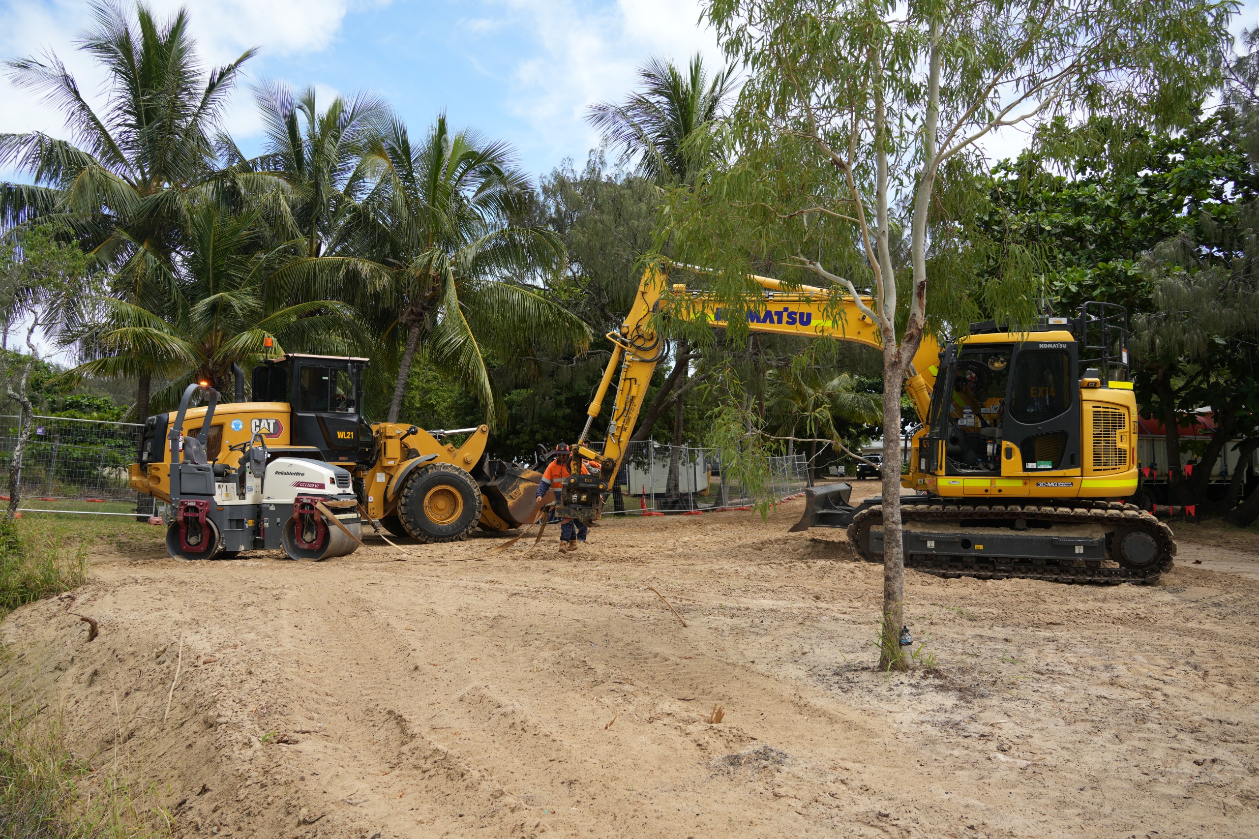 Image of large diggers and roller in amongst trees on Great Keppel Island