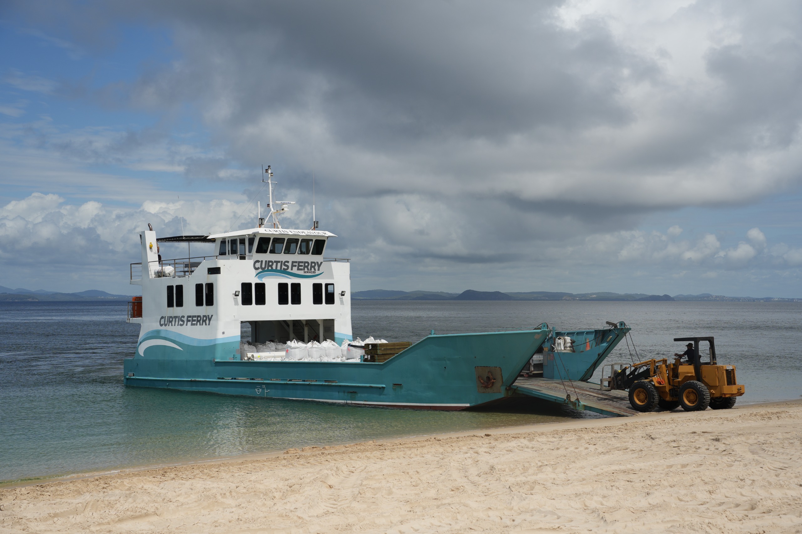 Image of Port Curtis ferry arriving on Fishermen's Beach.