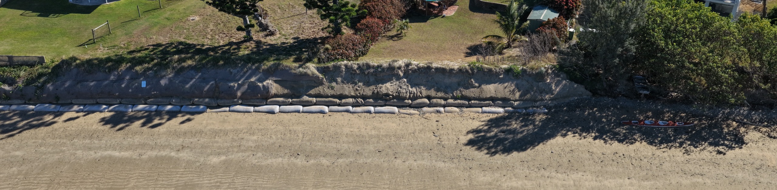 A close up showing the exposed sandbags on Muskers Beach
