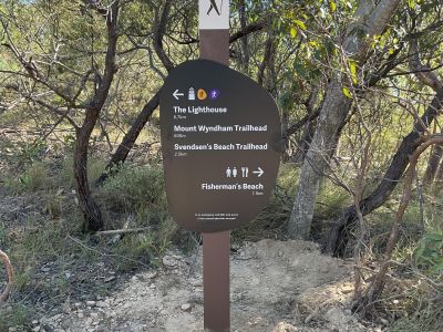 A photo of a trail marker installed on the island. 